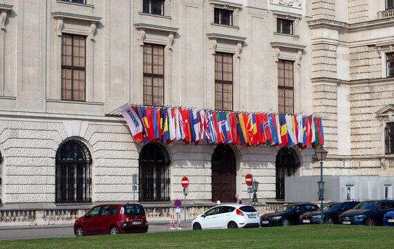OSCE office entrance. Many International Flags at Reichskanzleitrakt Building of Hofburg Palace. Vienna, Austria - June 21, 2026