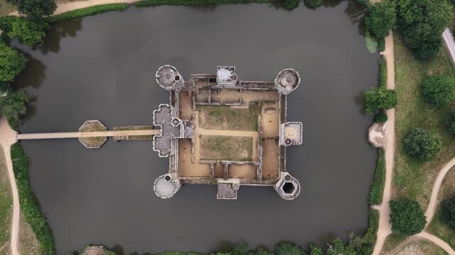 Aerial view of Bodiam Castle surrounded by a moat in Sussex during a bright day