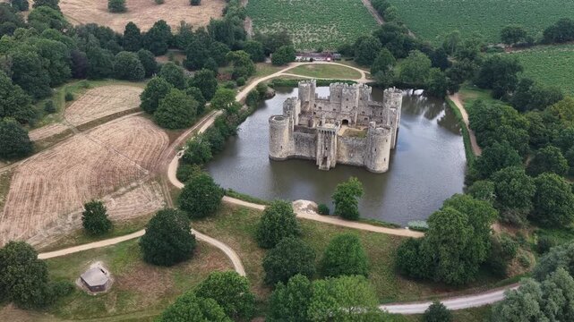 Aerial view of Bodiam Castle surrounded by a moat in England during summer daylight