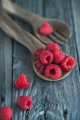 Fresh raspberries on a wooden spoon © Lili