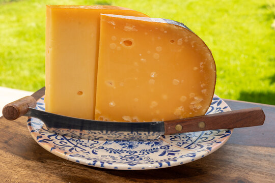 Aged Gouda, Dutch semi-hard cheese from Netherlands, golden-yellow colour, crystalline texture, cow milk matures cheese close up