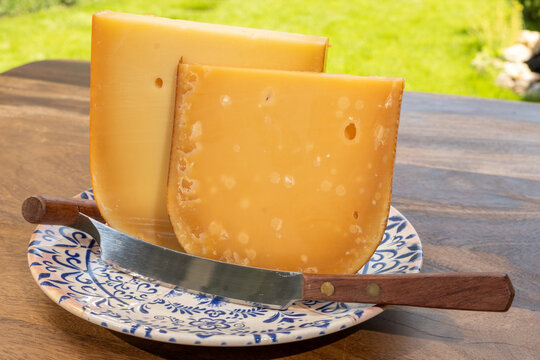 Aged Gouda, Dutch semi-hard cheese from Netherlands, golden-yellow colour, crystalline texture, cow milk matures cheese close up