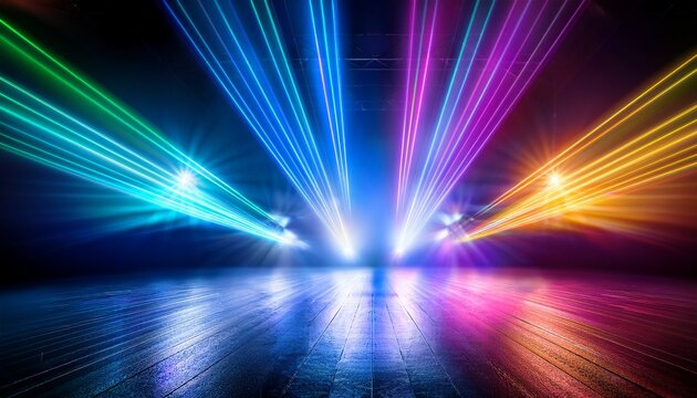 colorful stage lights illuminate a dark space creating an energetic atmosphere