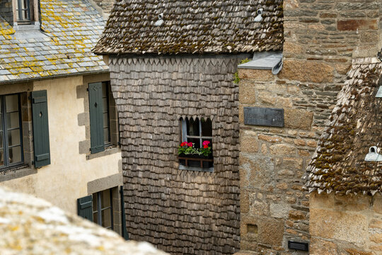 Architecture and buildings of Mont-Saint-Michel interior, medieval Gothic and Romanesque architecture, historic stone walls, columns, details. UNESCO heritage monument in Normandy, France