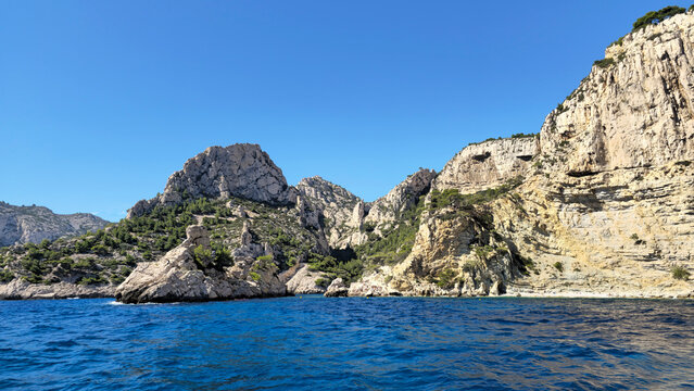 Calanque de Sugiton rocky cliff and Mediterranean Sea, Provence-Alpes-Cote d'Azur, France, Europe. Rocky coastline in Calanque de Sugiton, Bouches-du-Rh&ocirc;ne, France, Europe.