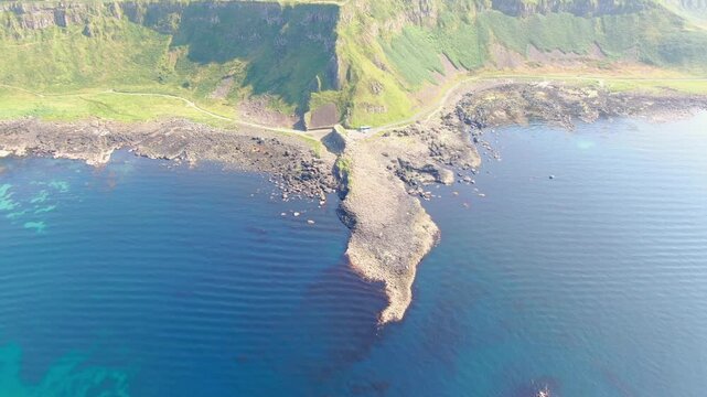 Spectacular aerial view of the iconic Giant's Causeway coastline in Northern Ireland. Drone Video of basalt columns, cliffs and Atlantic Ocean, and breathtaking coastal scenery