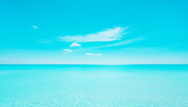 Tropical blue ocean view with horizon and soft clouds 雲が浮かぶ熱帯の青い海と水平線の風景