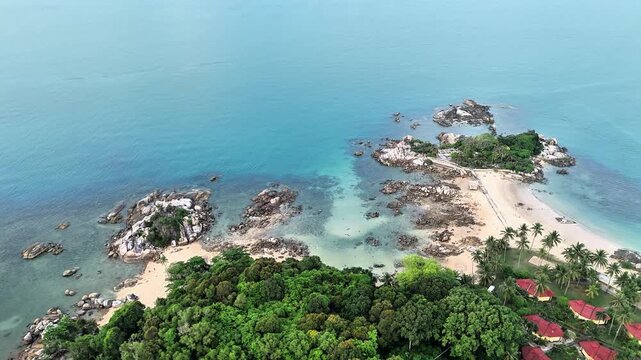 Aerial Drone View of Parai Tenggiri Beach Bangka Featuring Granite Islands Crystal Clear Turquoise Water Tropical Coastline and Peaceful Paradise