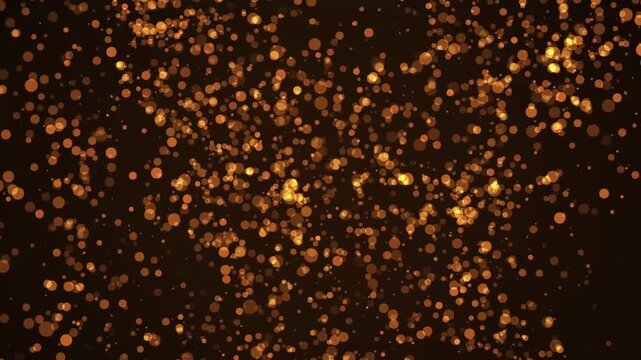 Golden sparkling particles float gently across dark space. Soft ambient movement defines these sparkling particles. Enjoy the warm glow of sparkling particles in motion.
