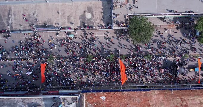 Drone view of massive people celebrating during immersion of lord Ganesha
