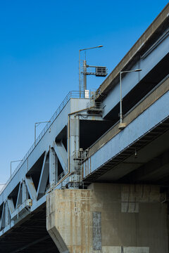 Industrial bridge structure with clear blue sky backdrop on a sunny day