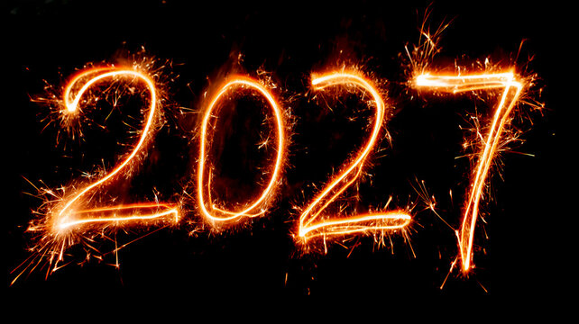 Glowing 2027 sparkler numbers on a black background, festive New Year celebration concept with bright fireworks and copy space