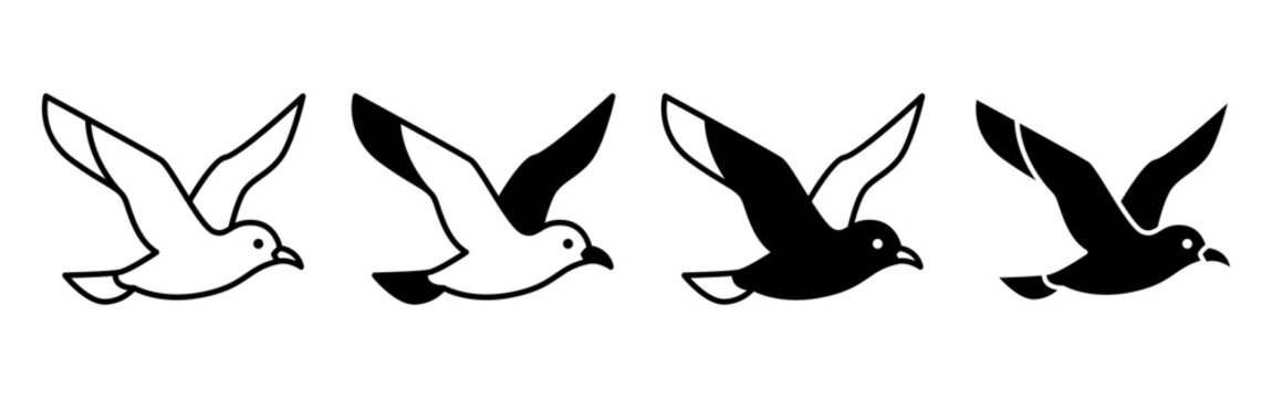 Set of Four Seagull Silhouette Icons in Flight.