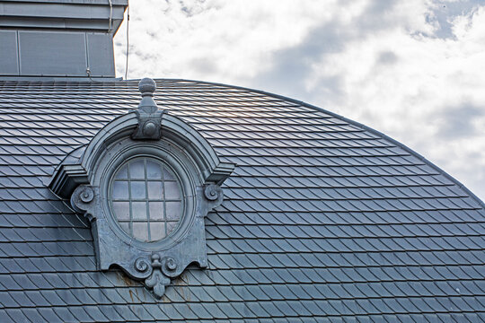 A metal-framed dormer window on the roof