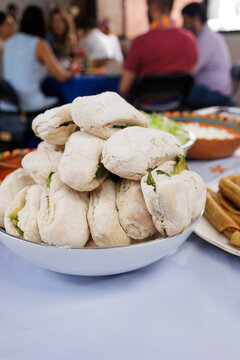 traditional mexican sandwich called chanclas in Mexico in a Mexican feast with Homemade food on table
