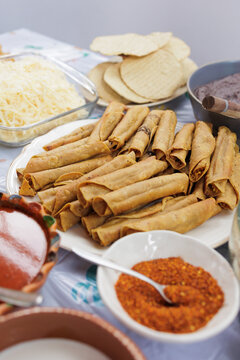 flautas de pollo or chicken fried tacos in Mexico Latin America, Mexican feast with Homemade food on table