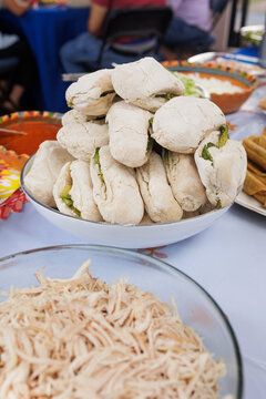 traditional mexican sandwich called chanclas in Mexico in a Mexican feast with Homemade food on table