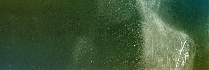Obraz premium Blank grained film strip texture background with heavy grain, dust and light leak