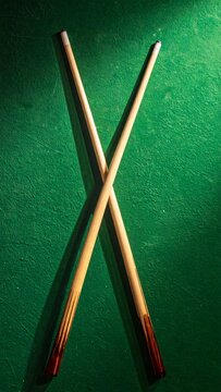Crossed Billiard Cues.