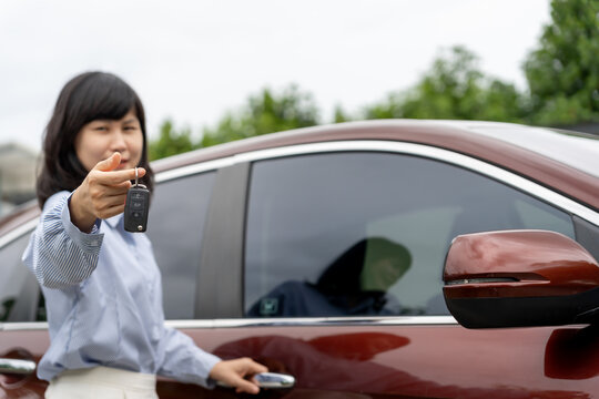 lease, rental car, sell, buy. Dealership manager send car keys to the new owner. Sales, loan credit financial, rent vehicle, insurance,  renting, Seller, dealer, installment, car care business