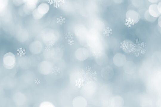 Blurred glitter effects background. Bright soft blue with hints of pearl color. Christmas background. Festive Christmas backdrop with holiday charm. Blurred bokeh light on dark blue background.