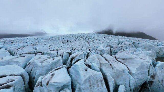 Aerial Drone Glacier Tilt Reveal Iceland Mountain Fog Crevasse Texture