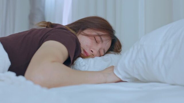 Woman sleep bed pillow blanket bedroom rest morning white tired sleeping peacefully under soft blanket with calm expression cozy bright bedroom relaxation comfort