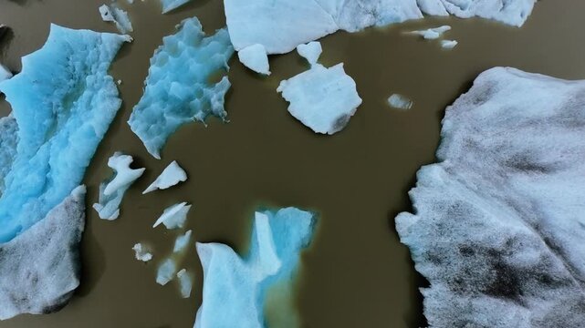 Aerial Drone Flies Through Scattered Icebergs Fjalls&aacute;rl&oacute;n Glacial Lagoon Iceland 