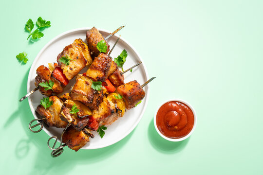Grilled shish kebab or meat skewers with vegetables.