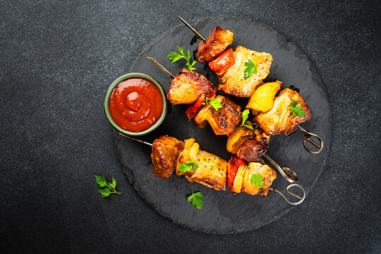 Grilled shish kebab or meat skewers with vegetables.