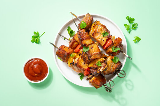 Grilled shish kebab or meat skewers with vegetables.