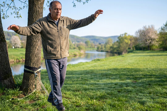 Senior Man Practicing Balance Exercise Outdoors for Healthy Active Aging and Mobility