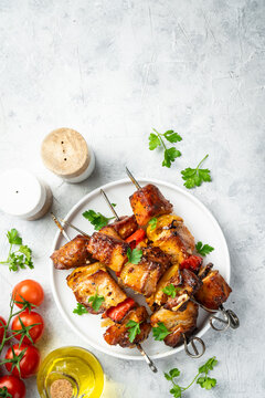 Grilled shish kebab or meat skewers with vegetables.