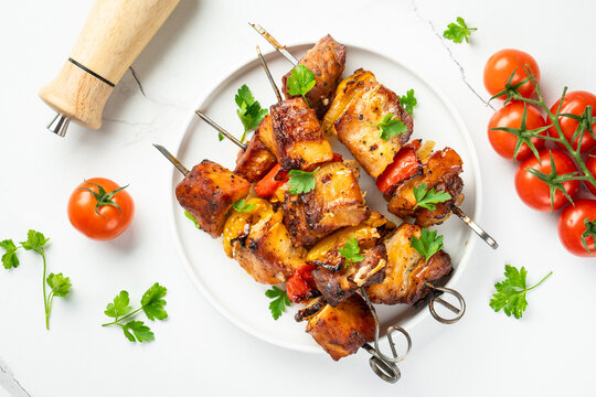 Grilled shish kebab or meat skewers with vegetables.