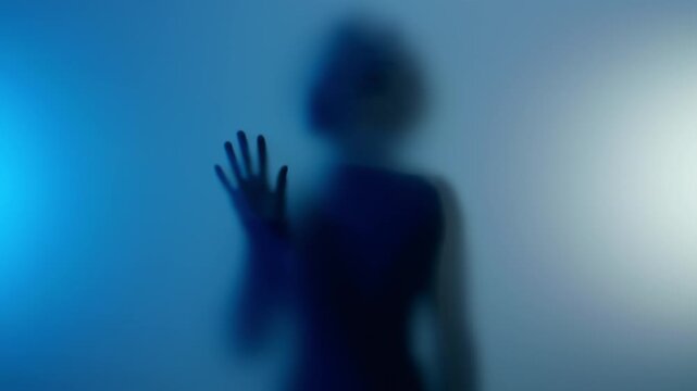Young black woman touching frosted glass and suddenly going away in emotional disappointment. 