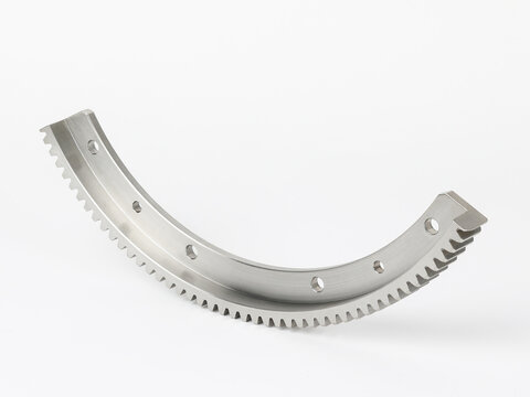Precision curved rack gear segment isolated on white background for industrial machinery