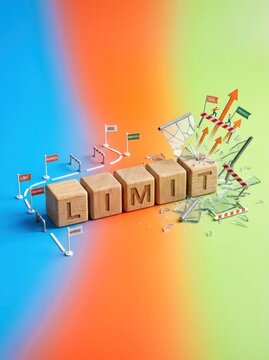 Wooden Blocks Spell Out Limit with Growth Chart and Flags.