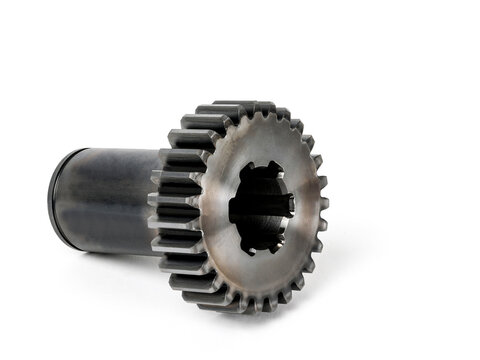 Precision machined steel spur gear shaft isolated on white background for industrial engineering applications