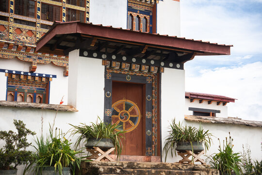 Traditional Bhutanese door with dharmachakra at temple, Nobgang Village