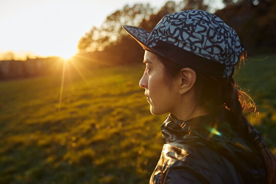 Runner Looking Towards Sunrise Before Outdoor Workout