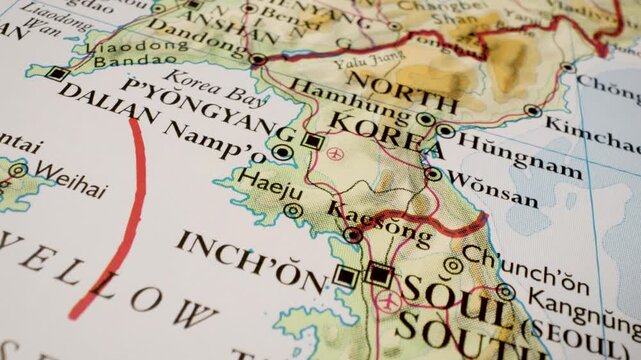 Gliding view from South Korea toward the North Korea border on a map