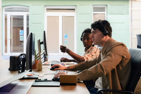 Two people working together at call center 