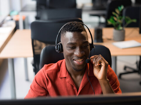 Man receiving a client inquiry at call center 