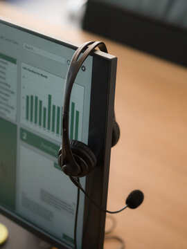 Headset hanging on computer monitor 