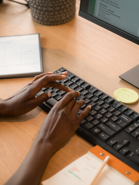 Woman typing on keyboard at work 