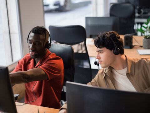 Call center workers collaborate at office 