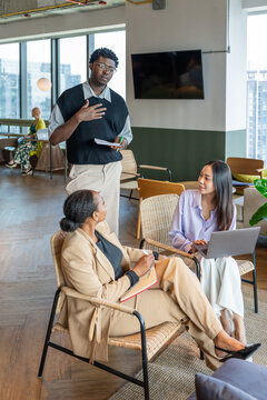 Group Talks in a Modern Office Space During a Work Session