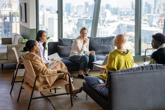 Discussion Among Five Individuals in a Modern Space With City View