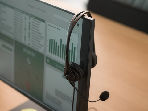 Headset on computer screen at help desk office 