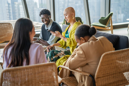Group of Friends in a Modern Office Space Discussing Ideas and Plans